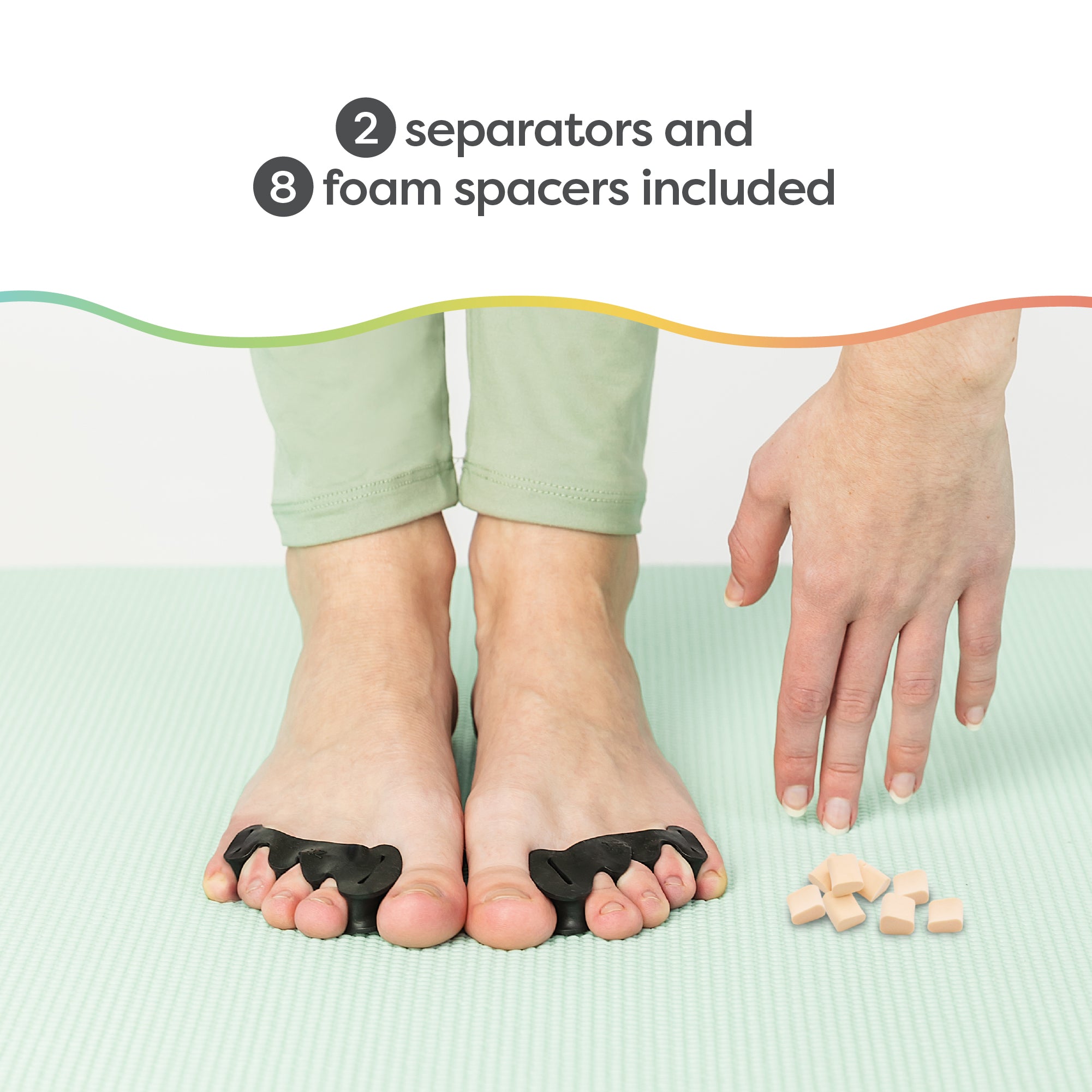 Feet with yoga toe separator socks on white background Stock